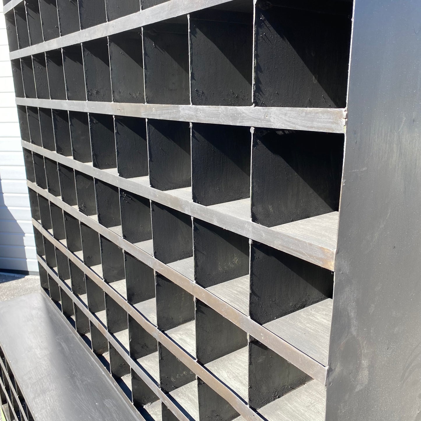 Heavy duty pigeon-hole metal shelving rack