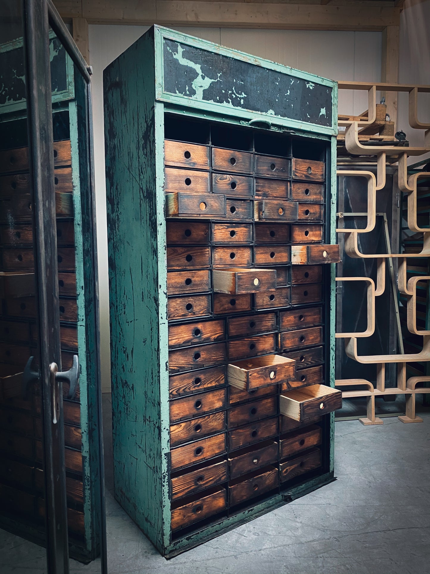 Rolling door closet with bank of drawers