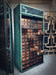 Rolling door closet with bank of drawers