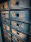 Rolling door closet with bank of drawers